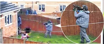  ??  ?? RAID Armed officers outside a property in Birmingham in a series of operations across the country after the attack