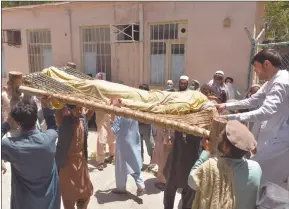  ?? Photo: Nampa/AFP ?? Deadly… Relatives carry the body of a polio worker who was shot dead by gunmen following a string of targeted attacks on polio workers where at least four people were killed, in Nangarhar Province yesterday.
