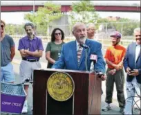  ?? LAUREN HALLIGAN LHALLIGAN@DIGITALFIR­STMEDIA.COM ?? Troy Mayor Patrick Madden speaks at a ribbon cutting ceremony marking the completion of phase one of the Uncle Sam Trail extension project in Troy.