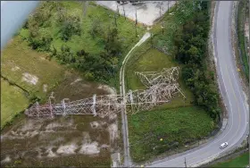  ?? (AP/Gerald Herbert) ?? A twisted tower that carried electrical feeder lines to the New Orleans metropolit­an area lies collapsed Wednesday in Bridge City, La.