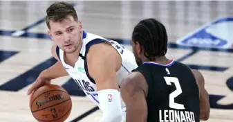  ?? Associated Press ?? Teams like Luka Doncic's (77) Dallas Mavericks might be more likely to upset their opponents in the unique bubble playoffs.