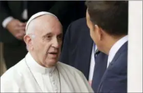  ?? MATT DUNHAM — THE ASSOCIATED PRESS ?? Above, Pope Francis meets with Irish Prime Minister Leo Varadkar, right, as he arrives at Dublin Castle, Ireland, Saturday. Pope Francis is on a two-day visit to Ireland.