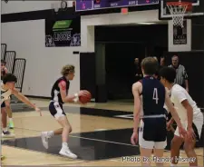  ?? Photo by Randy Hisner ?? Gavin Krull drives to the bucket in the second half of Bellmont’s victory over Leo. The sophomore knocked down two crucial free throws to aid the Braves.