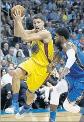  ?? SUE OGROCKI — THE ASSOCIATED PRESS ?? Warriors guard Klay Thompson, left, drives around Thunder forward Paul George during Tuesday’s victory.