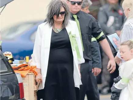  ?? Photo: DAVID UNWIN/FAIRFAX NZ ?? Alex Fisher’s mother, Sandra, and other relatives carry his casket at the Salvation Army church in Levin for the 10-year-old’s funeral.