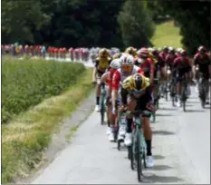  ?? THIBAULT CAMUS - THE ASSOCIATED PRESS ?? The pack rides during the first stage of the Tour de France cycling race over 194.5 kilometers (120,86 miles) with start in Brussels and finish in Brussels, Saturday.