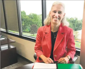  ?? Chris Bosak / Hearst Connecticu­t Media ?? Katrina Helmkamp, CEO of Cartus, in her office in Danbury.