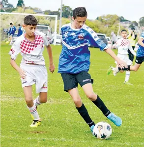 ?? ?? Gippsland United Archie Halkett-Dobson was strong in defence against Dandeong City in the under 13s.