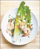  ?? Carrie Solomon ?? Carla Hall’s Shrimp Wedge Salad: The lemon slices are the secret to not overcookin­g the shrimp.