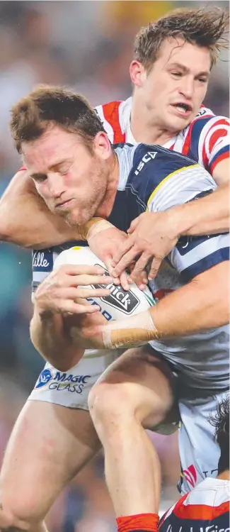  ?? NEW CHALLENGE: Gavin Cooper takes it to the Roosters in the Cowboys’ 29- 16 finals win. ??