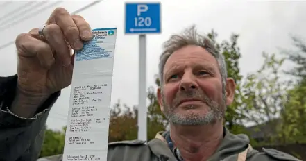  ?? JOSEPH JOHNSON/STUFF ?? John Dale has been fined for parking outside his house in the Christchur­ch suburb of Shirley.