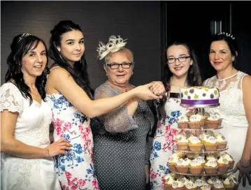  ??  ?? ● Yvonne Hendry (Lorraine’s sister), Aimie Hendry (Lorraine’s niece), Catherine Alexander (Lorraine’s mum), Ellie Mcdonald (Lorraine’s daughter), and Lorraine cut the cake