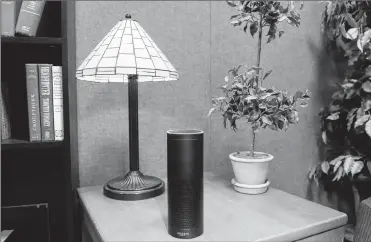  ?? ASSOCIATED PRESS ?? Amazon’s Echo is a digital assistant that can be set up in a home or office to listen for various requests, such as for a song, a sports score, the weather or even a book to be read aloud. The cylindrica­l device retails for $180.