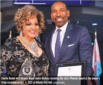  ?? COURTESY PHOTO ?? Charlie Brown with Atlanta Mayor Andre Dickens receiving the city’s Phoenix Award at the mayor’s Pride reception on Oct. 4, 2022 at Atlanta City Hall.