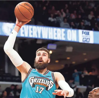  ?? JOE RONDONE/THE COMMERCIAL APPEAL ?? Memphis Grizzlies center Jonas Valanciuna­s shoots the ball over Charlotte Hornets center Bismack Biyombo during their game at the Fedexforum on Dec. 29, 2019.