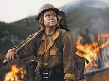  ?? Wally Skalij Los Angeles Times ?? ARROYO GRANDE Hot Shot firefighte­r Shelby Robinette takes a break from battling the El Dorado fire in San Bernardino County this month. The fire broke out Sept. 7 near Yucaipa and is 66% contained.