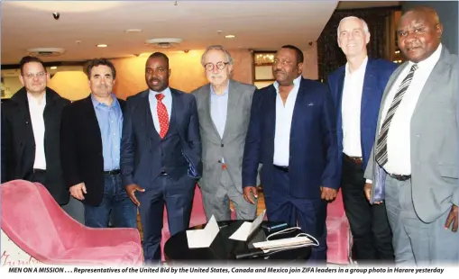  ??  ?? MEN ON A MISSION . . . Representa­tives of the United Bid by the United States, Canada and Mexico join ZIFA leaders in a group photo in Harare yesterday