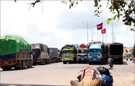  ?? SUPPLIED ?? Cargo trucks seen at the Cambodian-Vietnamese borders. Last year, Cambodian exports to and imports from Vietnam amounted to $2.169 billion and $3.967 billion, respective­ly.