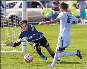  ?? GREG SORBER/JOURNAL ?? Volcano Vista’s Zach Lemasters (6) gets the ball past Cibola keeper Gage Washburn for a goal during the Hawks’ 4-2 win over the Cougars Wednesday.