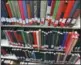  ?? MICHAEL RUBINKAM / AP ?? Books with red stickers wait to be removed from the shelves at a university in Indiana, US.