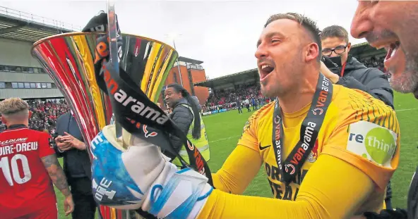  ??  ?? IN SAFE HANDS: Dean Brill celebrates winning the Vanarama Trophy with Leyton Orient at the Breyer Group Stadium in London.