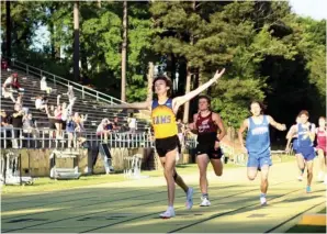  ?? The Sentinel-Record/James Leigh ?? ■ Lakeside’s Dylan Dew crosses the finish line to win the 1600-meter run at the Class 5A state track meet at Hot Springs Thursday.