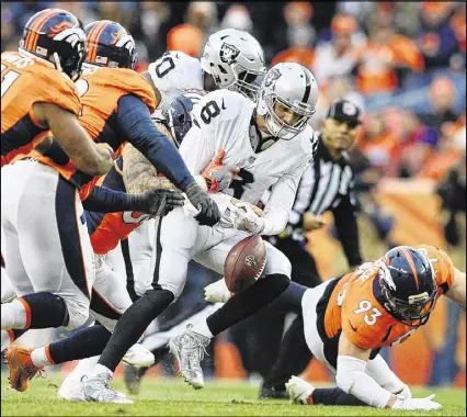  ?? DUSTIN BRADFORD / GETTY IMAGES ?? Connor Cook, replacing the injured Matt McGloin at quarterbac­k for the Raiders, passed for 150 yards with a touchdown and an intercepti­on, but also fumbled twice, losing one.