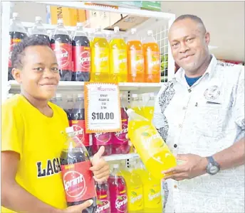  ?? Picture: SUPPLIED ?? Peni Sadrau and Koini Sadrau of Rakiraki with Sprint Juice at CJ Supermarke­t in Nabua.