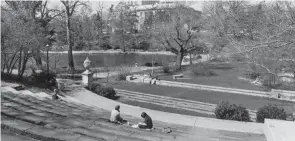  ?? DISPATCH FILE PHOTO ?? Students sit in Browning Ampitheatr­e at Ohio State University, with Mirror Lake and Thompson Library in the view in 1984. With more than 150 years of history, Ohio State has plenty of ghost stories and urban legends across campus.