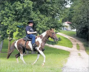  ?? Brynn Anderson Associated Press ?? ROY MOORE, the outspoken former chief justice of the Alabama Supreme Court, rode to the polls. “Time for conservati­ves across Alabama to unite and deliver a knockout punch to the establishm­ent!” Moore said.