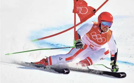  ?? MICHAEL MADRID/USA TODAY SPORTS ?? Gold medal winner Marcel Hirscher competes in the men’s giant slalom Sunday at Yongpyong Alpine Center in Pyeongchan­g, South Korea.