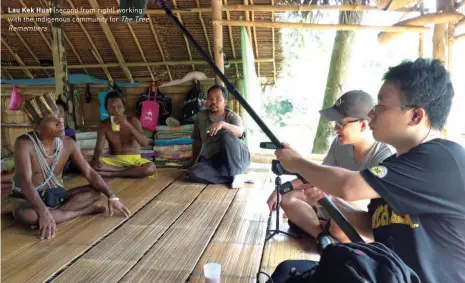  ??  ?? Lau Kek Huat (second from right) working with the indigenous community for The Tree Remembers