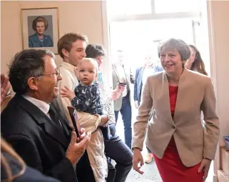  ??  ?? British Prime Minister Theresa May arrives to give a speech at the Ealing Conservati­ve Associatio­n in London recently. (AFP)