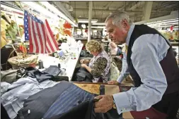  ?? MARILYNN K. YEE — THE NEW YORK TIMES ?? Tailor Martin Greenfield at Martin Greenfield Clothiers, his men's suit-making factory in Brooklyn, on Oct. 13, 2010. Greenfield, 95, died in March in Manhasset, N.Y.