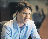  ?? NATHAN ROCHFORD/THE GUARDIAN ?? Prime Minister Justin Trudeau sits down for a one-on-one interview with Guardian reporter Teresa Wright at the Charlottet­own Airport on Thursday.