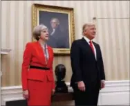  ?? THE ASSOCIATED PRESS ?? President Donald Trump stands with British Prime Minister Theresa May on Friday in the Oval Office of the White House.