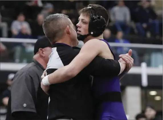  ?? PHOTO BY PAUL CONNORS — MEDIA NEWS GROUP/BOSTON HERALD ?? Shawsheen Tech’s Sidney Tildsley, right, leaps into the arms of assistant coach Nick Gamble after winning a New England title.
