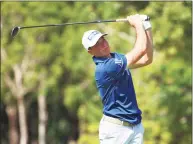  ?? Mike Ehrmann / Getty Images ?? Viktor Hovland plays his shot from the second tee during the third round of the World Wide Technology Championsh­ip on Saturday.