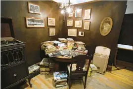  ?? PHIL VELASQUEZ/CHICAGO TRIBUNE ?? At Intuit: The Center for Intuitive and Outsider Art, Henry Darger’s apartment is re-created with personal belongings and artifacts in the Henry Darger Room, shown on Jan. 31, 2017.