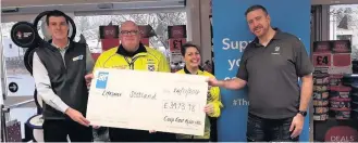  ??  ?? Cheque this out Pictured from left to right is Stephen Feerick, East Kilbride team manager, Paul McGoldrick and Sheila Baxendale of Lifesaver Scotland – Bloodbikes and Andy Brown from Co-op Funeralcar­e