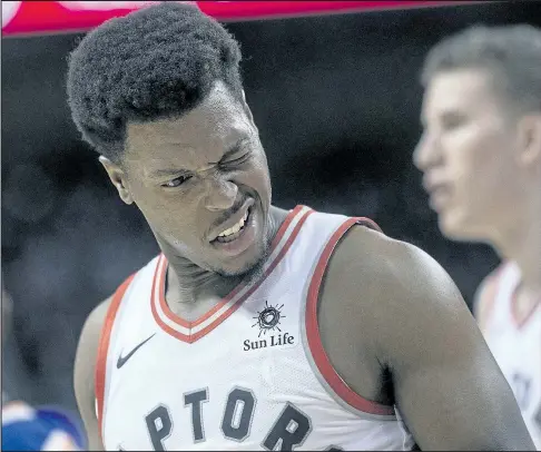  ?? THE CANADIAN PRESS ?? Raptors guard Kyle Lowry reacts after being caught by an elbow during Friday night’s game against the New York Knicks.
