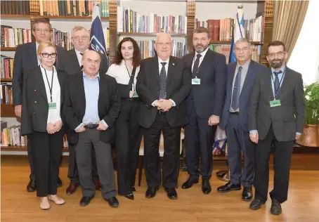  ?? (PR) ?? PRESIDENT REUVEN RIVLIN (center) meets with Babi Yar Holocaust Memorial Center Advisory Board chairman Natan Sharansky (second from left); Dr. Arkadi Zeltser (far right), director of the Moshe Mirilashvi­li Center for Research of the Holocaust in the Soviet Union: Internatio­nal Institute for Holocaust Research; and Babi Yar Holocaust Memorial Center executives, on February 8, 2018.