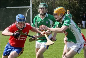  ??  ?? Mark Boland of Tara Rocks is confronted by Darren Carty (Taghmon-Camross).