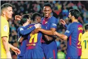  ??  ?? Barcelona's Ousmane Dembele (C) celebrates with teammates Yerry Mina (2ndR), Luis Suarez (R) and Lionel Messi after scoring against Villarreal at the Camp Nou Stadium.