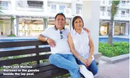  ??  ?? Henry and Marilou Martinez in the gazebo beside the lap pool.