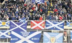  ??  ?? Scotland fans in the stands at the Loro Borici Stadium, in Shkoder, Albania