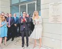  ?? Photos by Khalil Hamra , AP (top); Menahem Kahana, AFP/Getty Images ?? Above, an elderly Palestinia­n man falls after being shot by Israeli troops during a protest at the Gaza Strip’s border with Israel on Monday. Left, U.S. Treasury Secretary Steve Mnuchin and Ivanka Trump attend the opening of the U.S. embassy in...