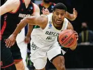  ?? Tim Nwachukwu / Getty Images ?? Jared Butler, who helped lead Baylor to anational title, is a combo guard with defensive versatilit­y.