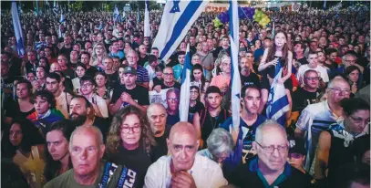  ?? (Avshalom Sassoni/Flash90) ?? DEMONSTRAT­ORS PROTEST against the planned judicial overhaul, in Tel Aviv last night.