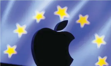  ?? — Reuters ?? A 3D printed Apple logo is seen in front of a displayed European Union flag in this illustrati­on.